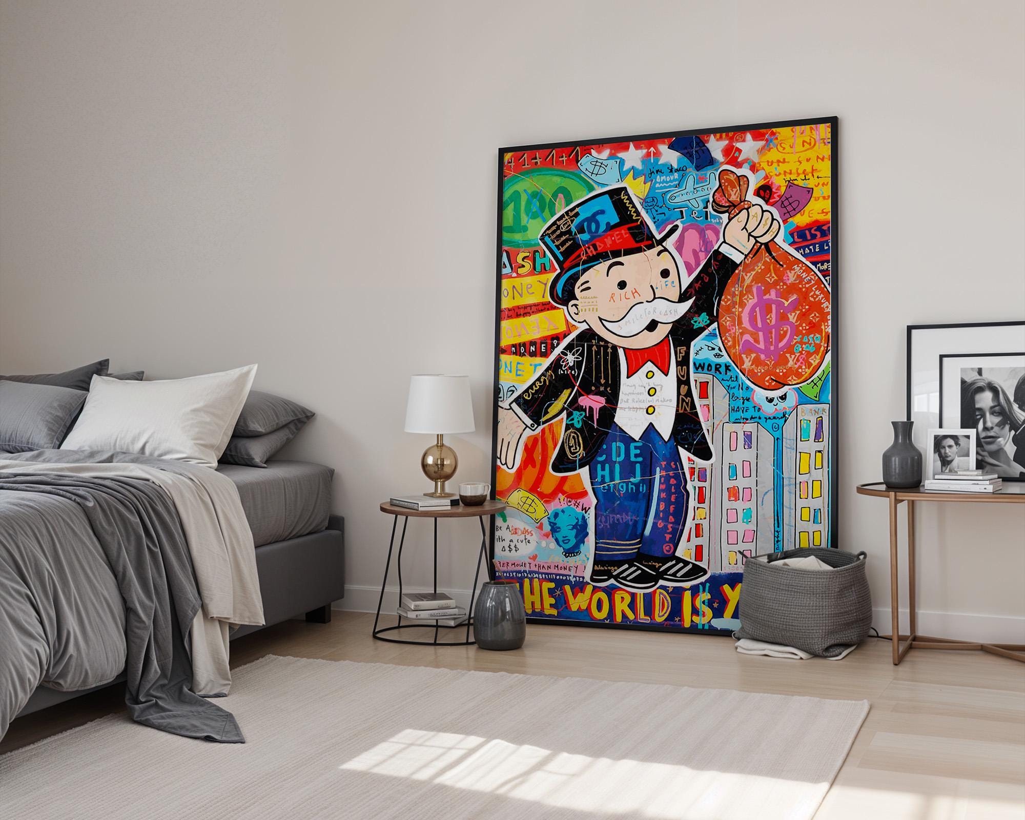 Eclectic graffiti pop art poster featuring the Monopoly Man holding a large red money bag in front of a colorful city skyline with layered text and doodles. The phrase “THE WORLD IS YOURS” anchors the piece, radiating motivation and wealth symbolism. Ideal for modern collectors, financial professionals, or fans of street-style pop art. Adds bold personality to offices, studios, or lounges.